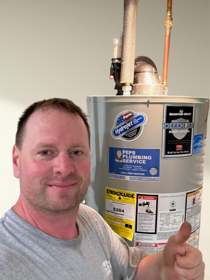 Peps Plumbing Service technician with a newly installed water heater
