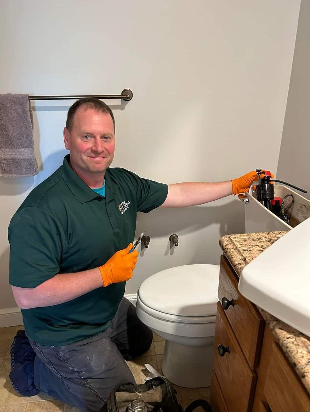 Peps Plumbing technician fitting a toilet