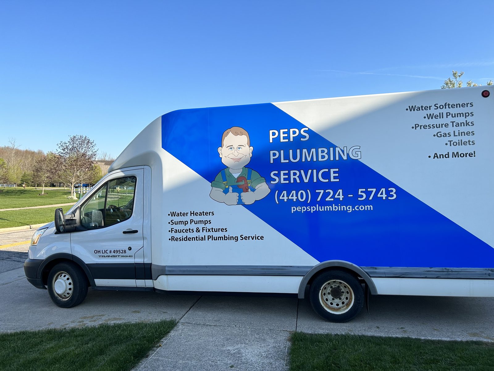 Peps Plumbing service van parked on a Chardon street